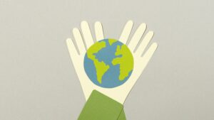 A poster of hand and globe for sustainable living. 