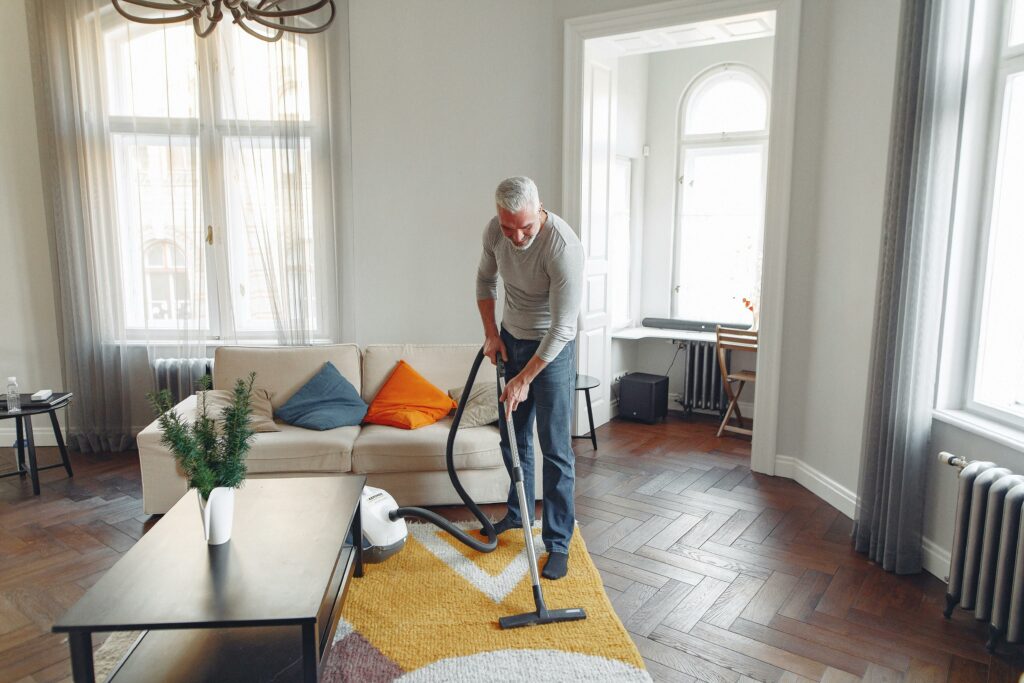 a man cleaning carpet