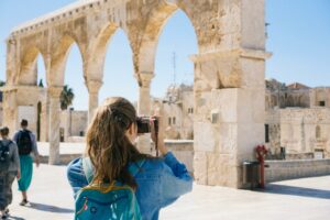 A girl taking a photo on a trip