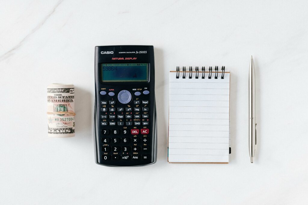 A photo of notepad and calculator