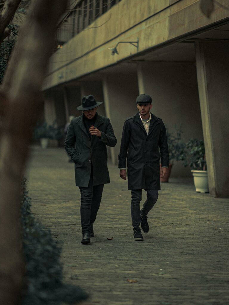 two men dressing sleek walking