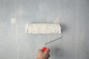 paint roller on wall to upgrade your bathroom