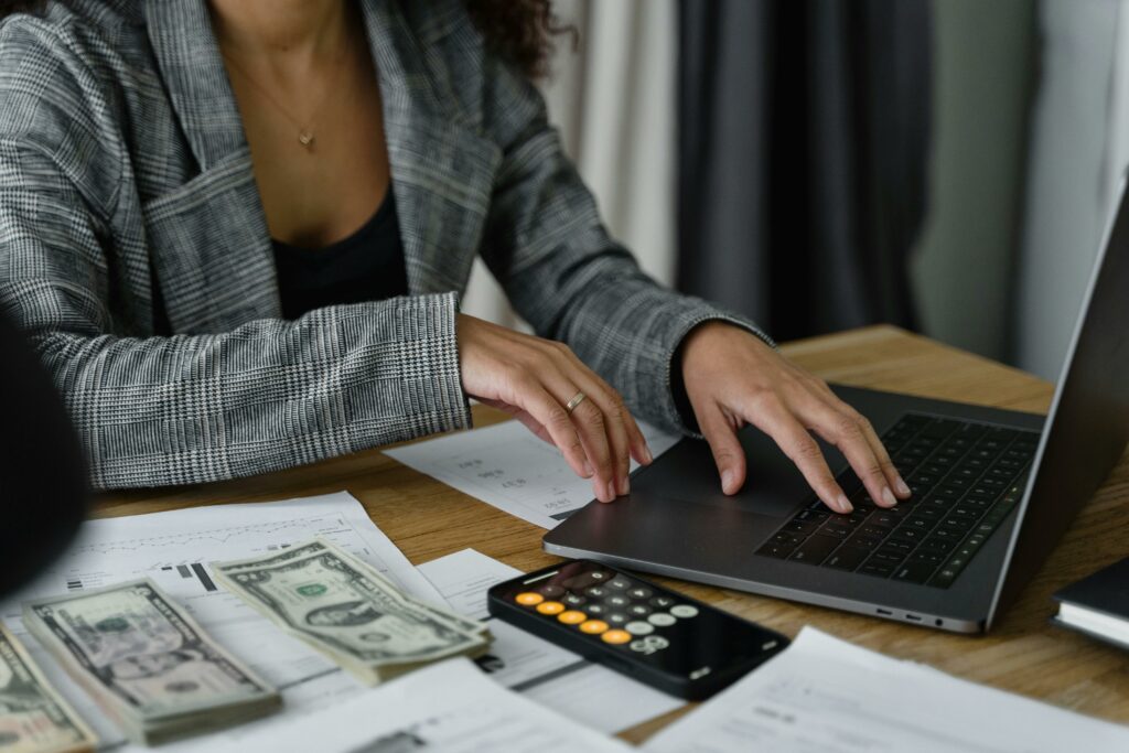 woman at computer practicing financial literacy